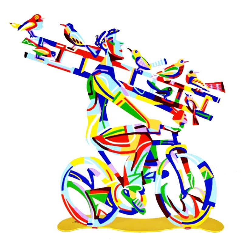 סטנד "רוכב עם סולם" Ladder Man - סטנד מתכת ( 36 * 36 ס"מ, 0.9 ק"ג ) צבעוני בעבודת יד עם הדפס דו צדדי על מתכת בחיתוך לייזר. צבעוני ובגימור לכה. סטנד מהמם בצורת איש הרוכב על אופניו עם סולם. על גבי הסולם ציפורים על גבי הסולם - מעוצב ומיוצר ע"י האמן דוד גרשטיין. פסל מתכת מקסים זה להנחה על השולחן מדף מאת דייוויד גרשטיין, החוקר את אחד הנושאים החביבים עליו ביותר, רכיבה על אופניים.