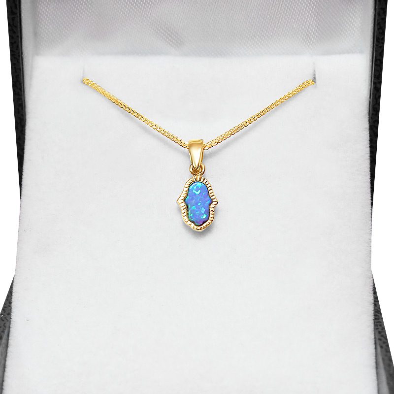 Small Hamsa pendant (1.2*0.7 cm) in 14k yellow gold with opal stone