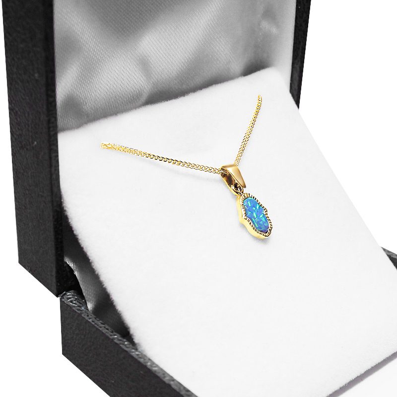 Small Hamsa pendant (1.2*0.7 cm) in 14k yellow gold with opal stone