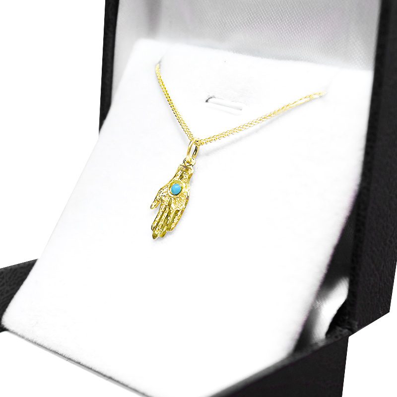 Small Hamsa pendant (1.6*0.8 cm) in 14k yellow gold set with turquoise stone