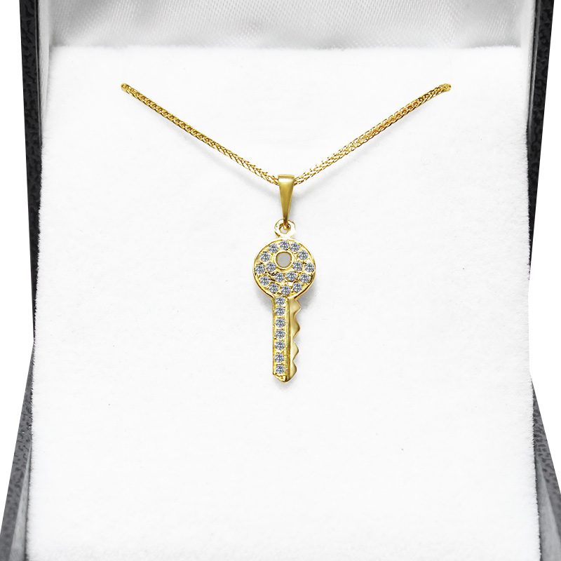 "Key" pendant (2.2*0.8 cm) in 14k yellow gold with crystals