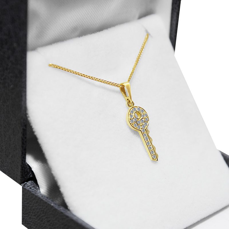 "Key" pendant (2.2*0.8 cm) in 14k yellow gold with crystals