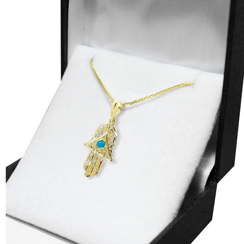 Hamsa pendant (2.4*1.5 cm) in 14k yellow gold with turquoise stone and filigree decorations